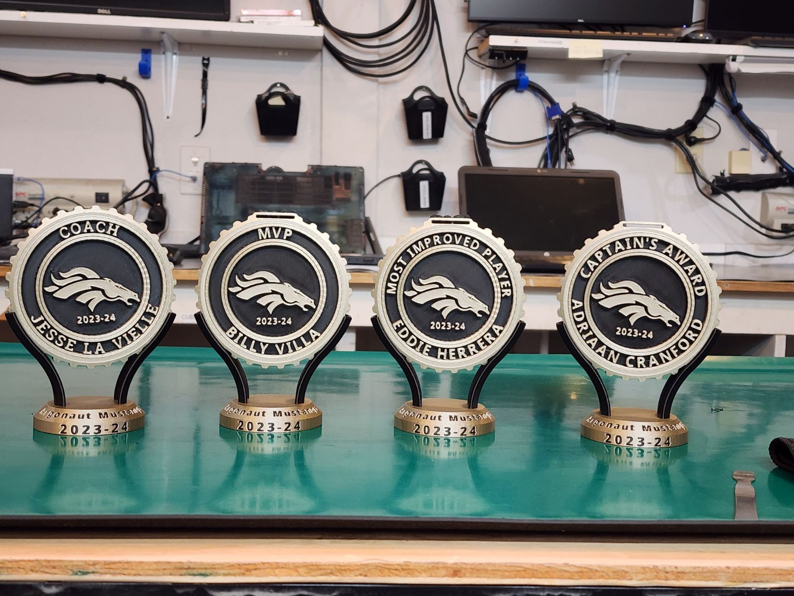Four custom 3D-printed trophies