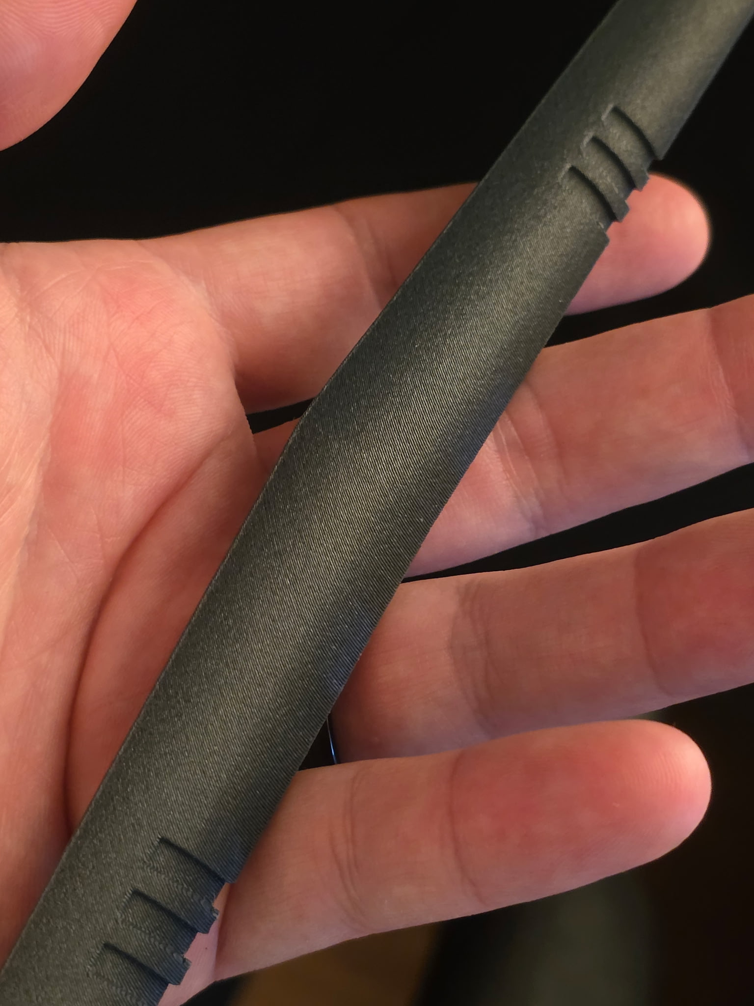 Carbon-fiber ASA dashboard trim section shown in hand